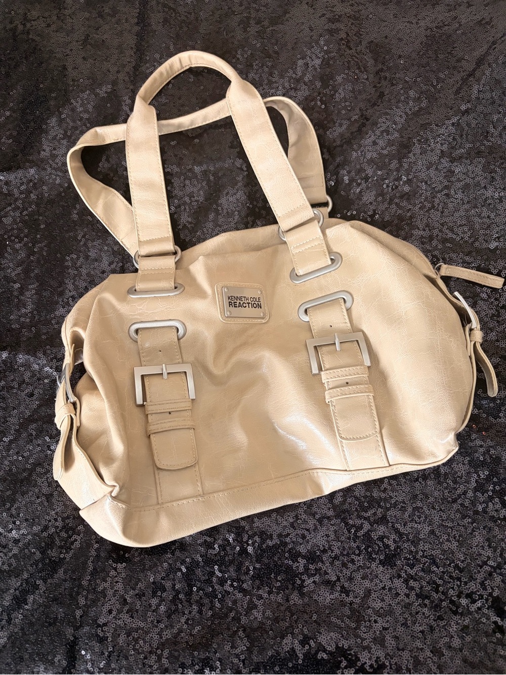 Kenneth Cole Reaction beige duffel bag with buckle straps